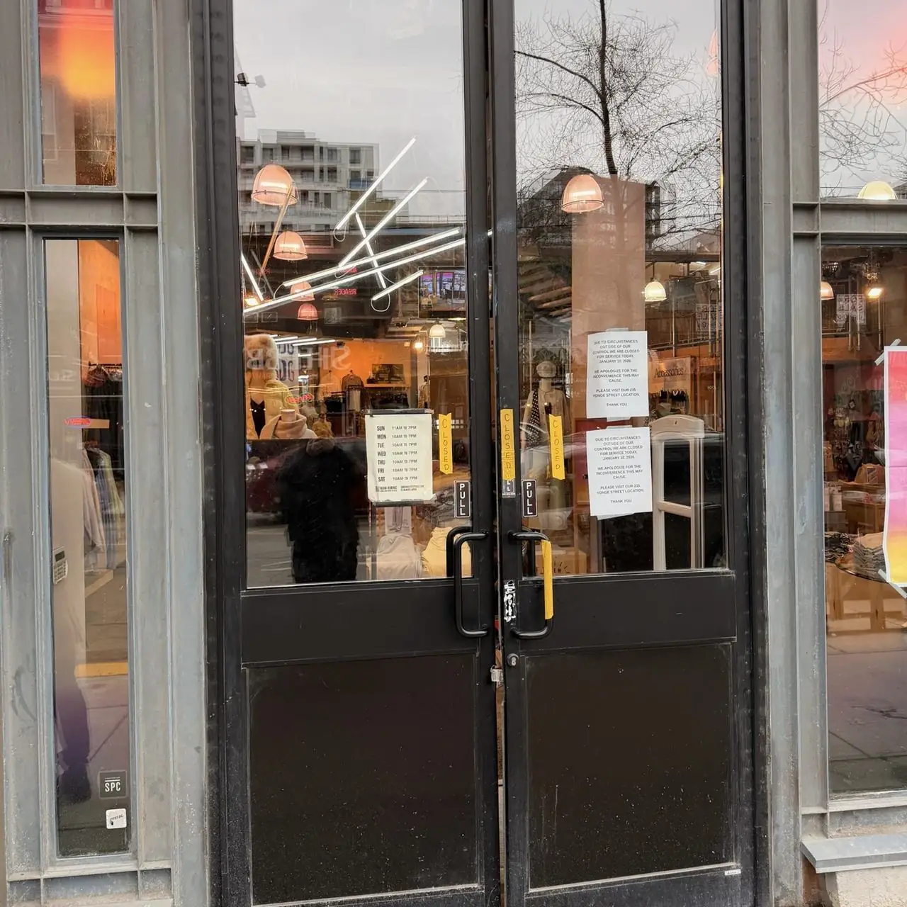Commercial double storefront doors inspected during emergency break-in repair