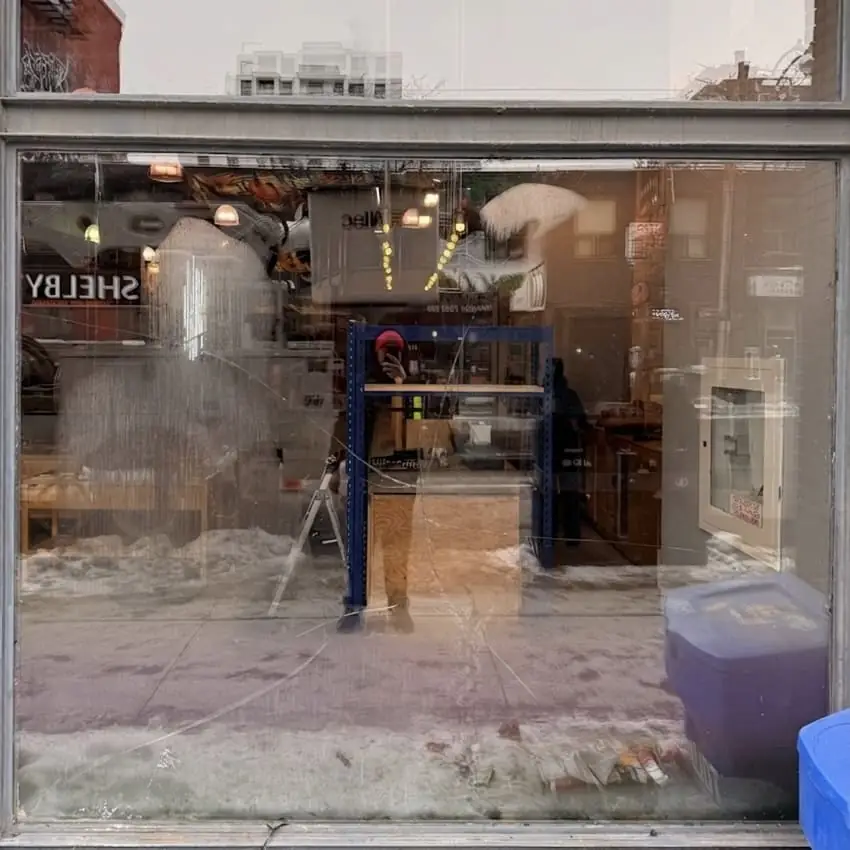 Broken commercial insulated glass unit before replacement