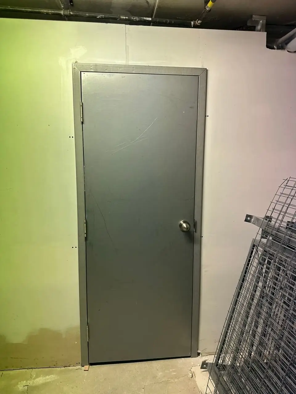 Steel storage room door installed in a North York commercial space with secure hardware