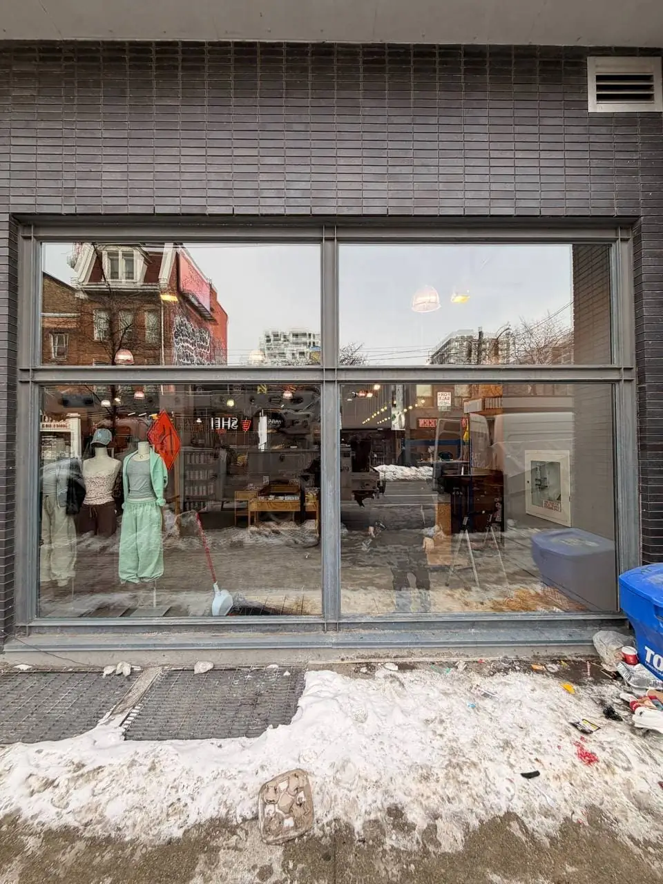 Queen West storefront glass unit replaced in Toronto with a clear shop window finish