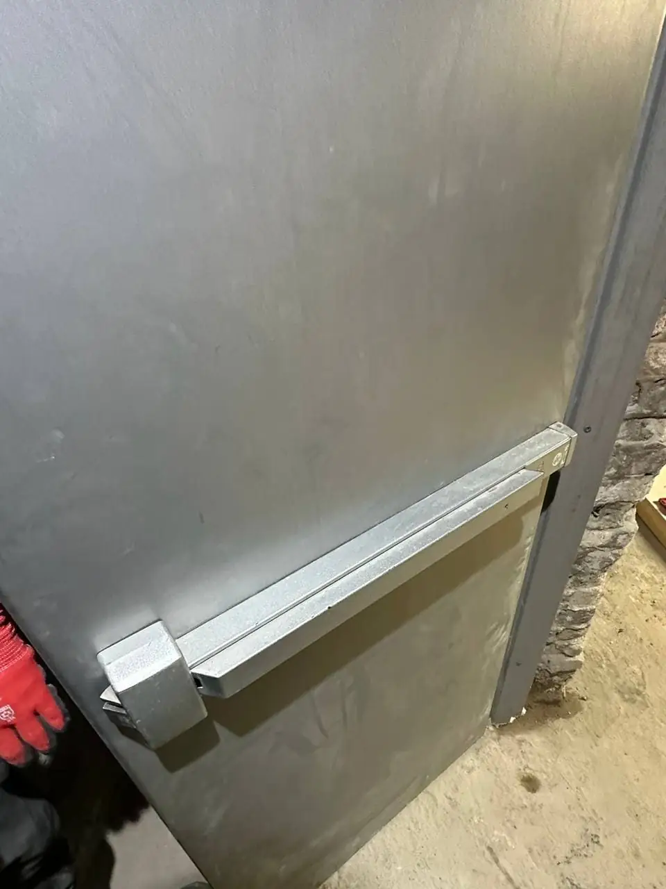 Push bar installed on a Brock Township metal exit door for safer commercial egress