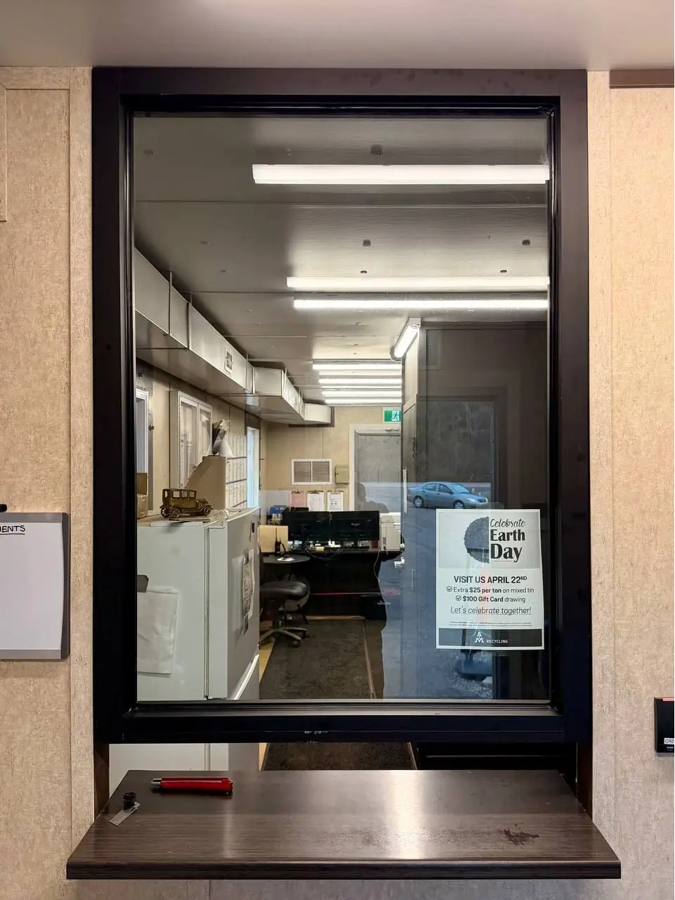 Armored glass replaced in a Cedar Valley service window opening.