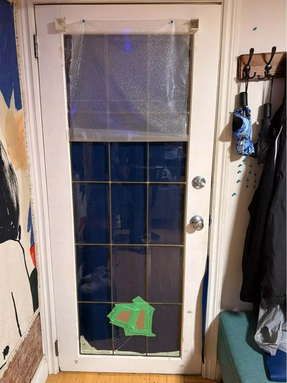 Broken interior door glass panel in an Etobicoke hallway before replacement