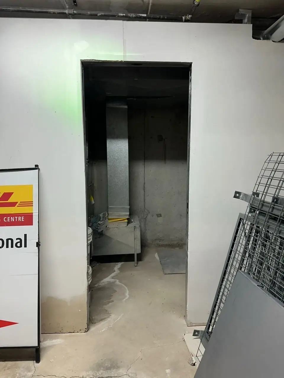 North York commercial storage room opening before new steel door installation