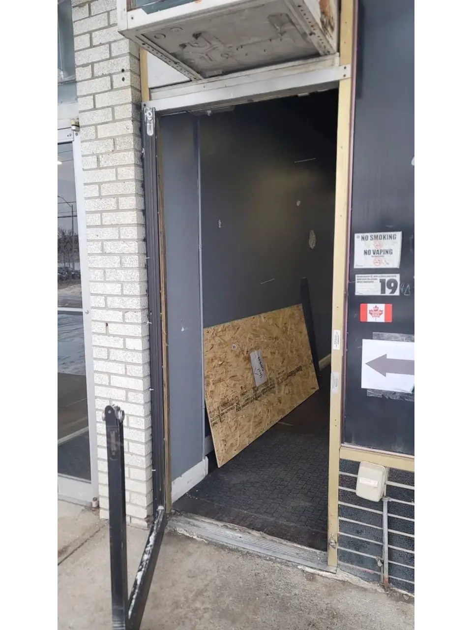 Mississauga business entrance after break-in damage before emergency board-up