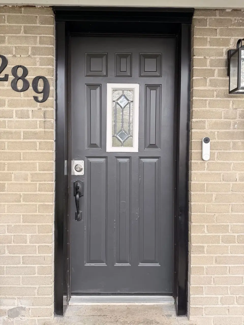 Old Oakville glass front door before replacement with a solid privacy entry door
