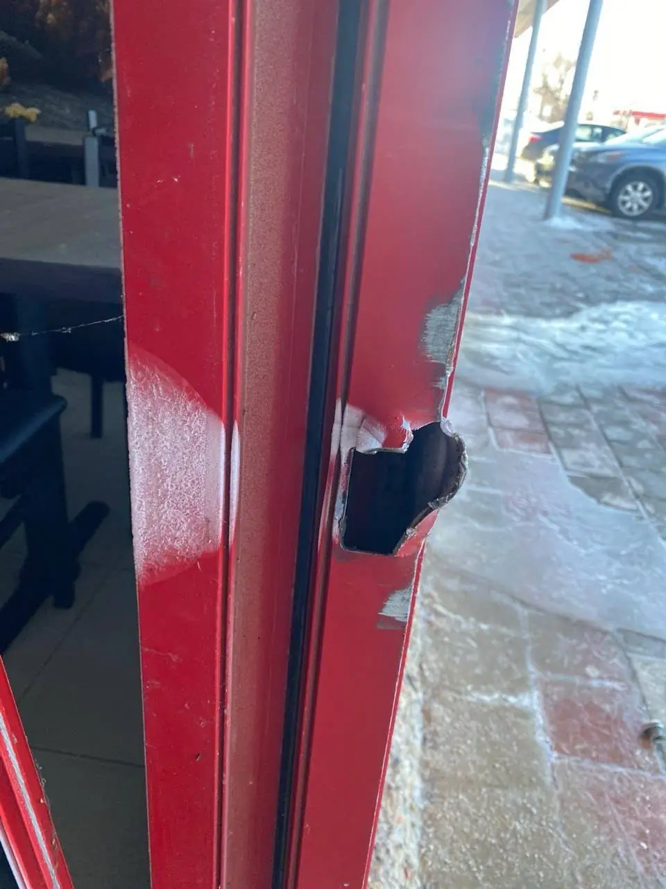 Thornhill store door lock-side damage after break-in attempt before repair