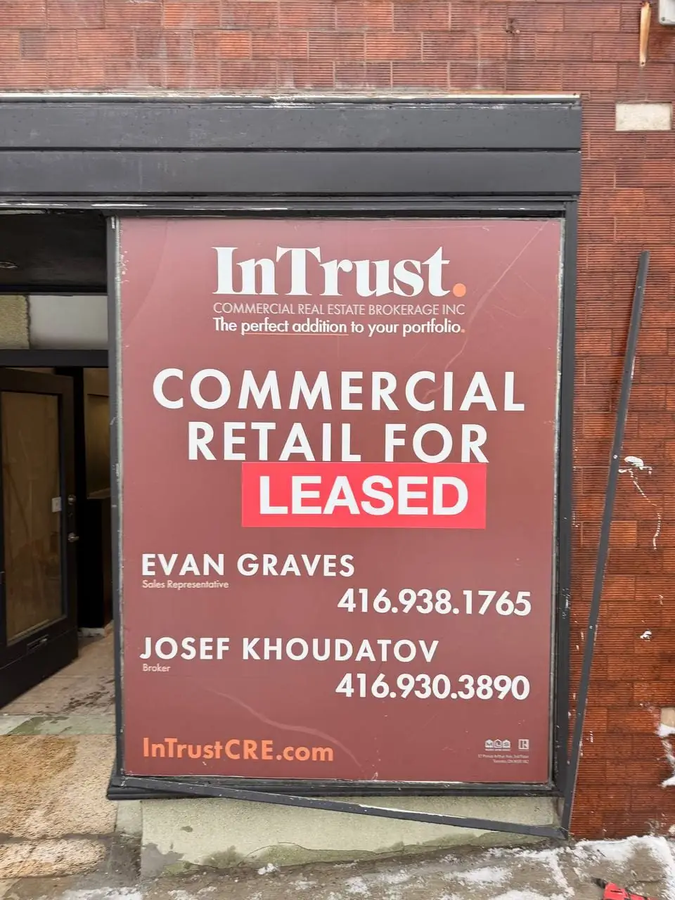 Georgina retail front window before clear storefront glass replacement