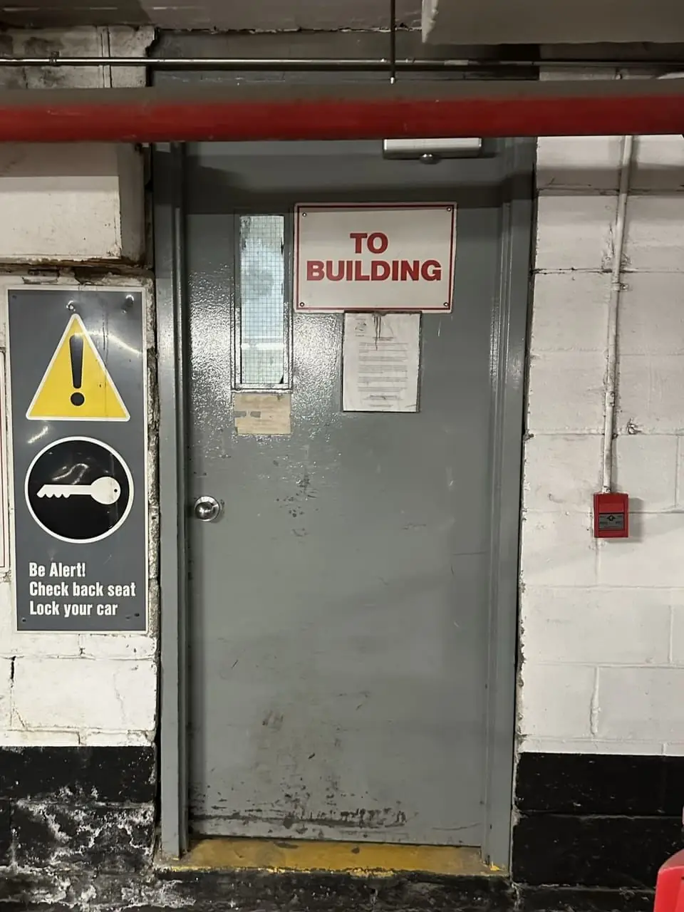Old fire-rated metal door in Halton Hills before replacement with a new steel door and GPW vision lite