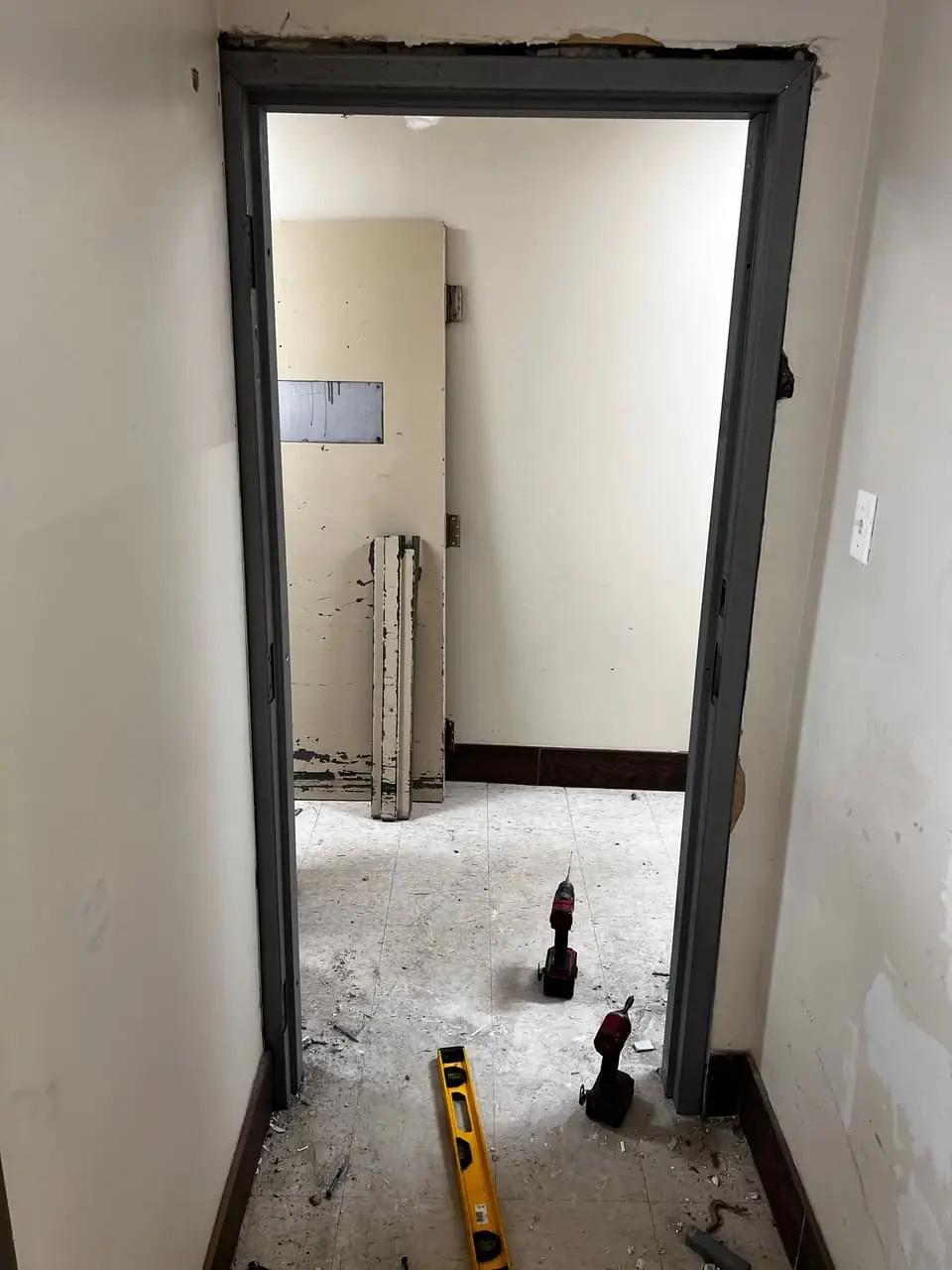 Whitby laundry-room opening after door removal and before the replacement fire-rated door was fitted.