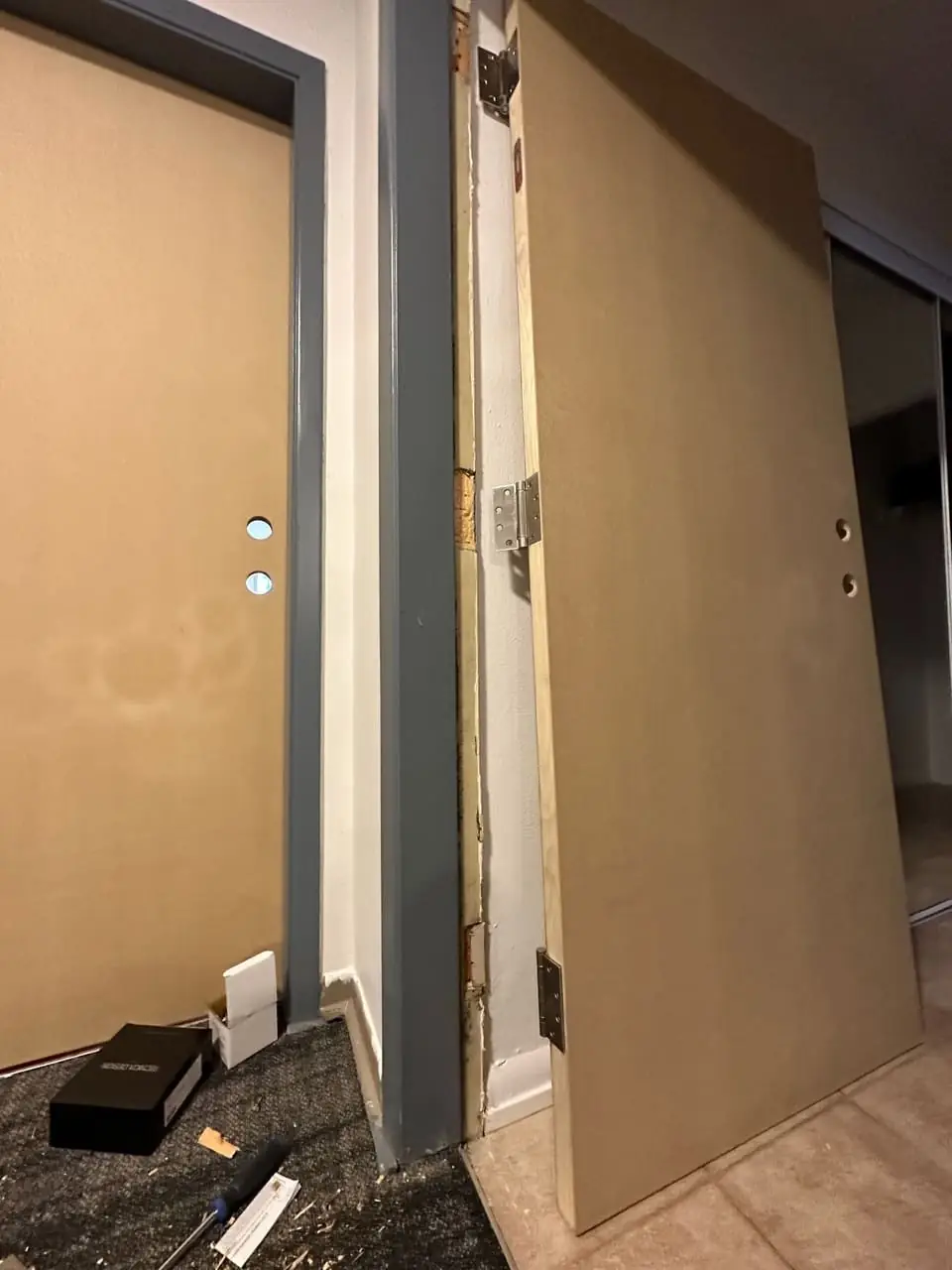 Office-room door work in progress in the Vaughan corridor.