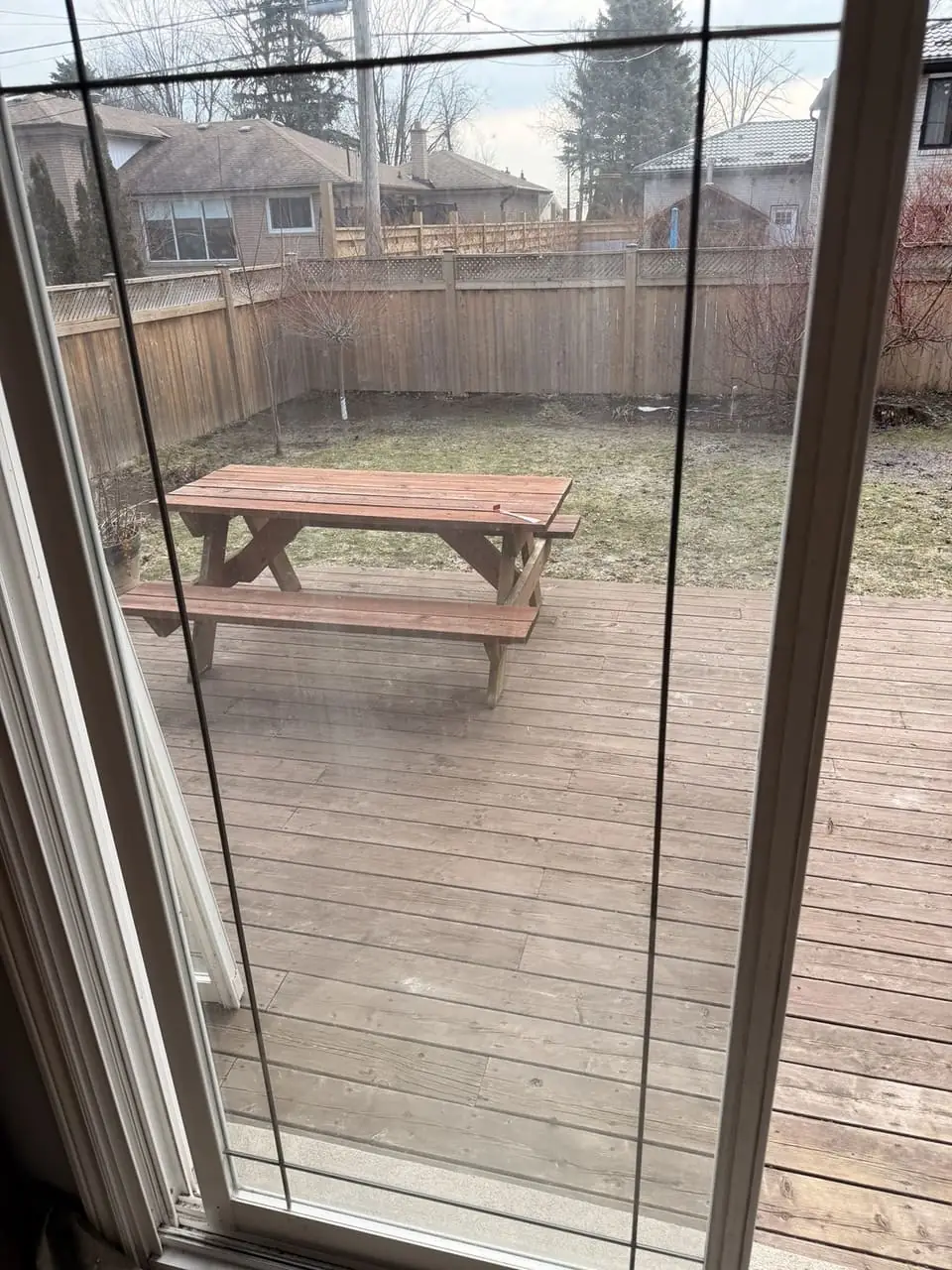 Foggy Aurora patio door glass before sealed unit replacement in the existing frame