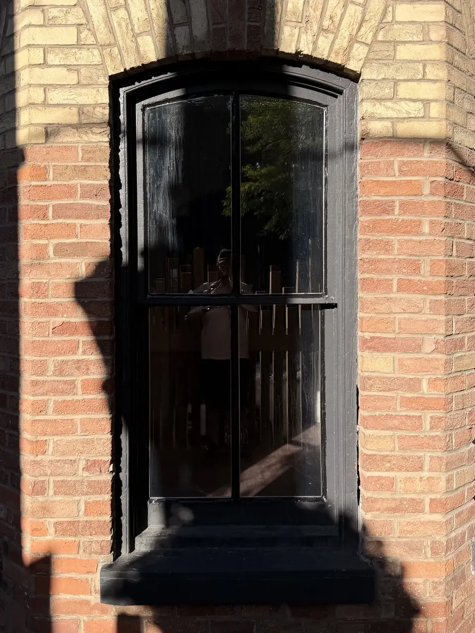 Restored old wooden window after glass replacement and full re-sealing in Cabbagetown Toronto