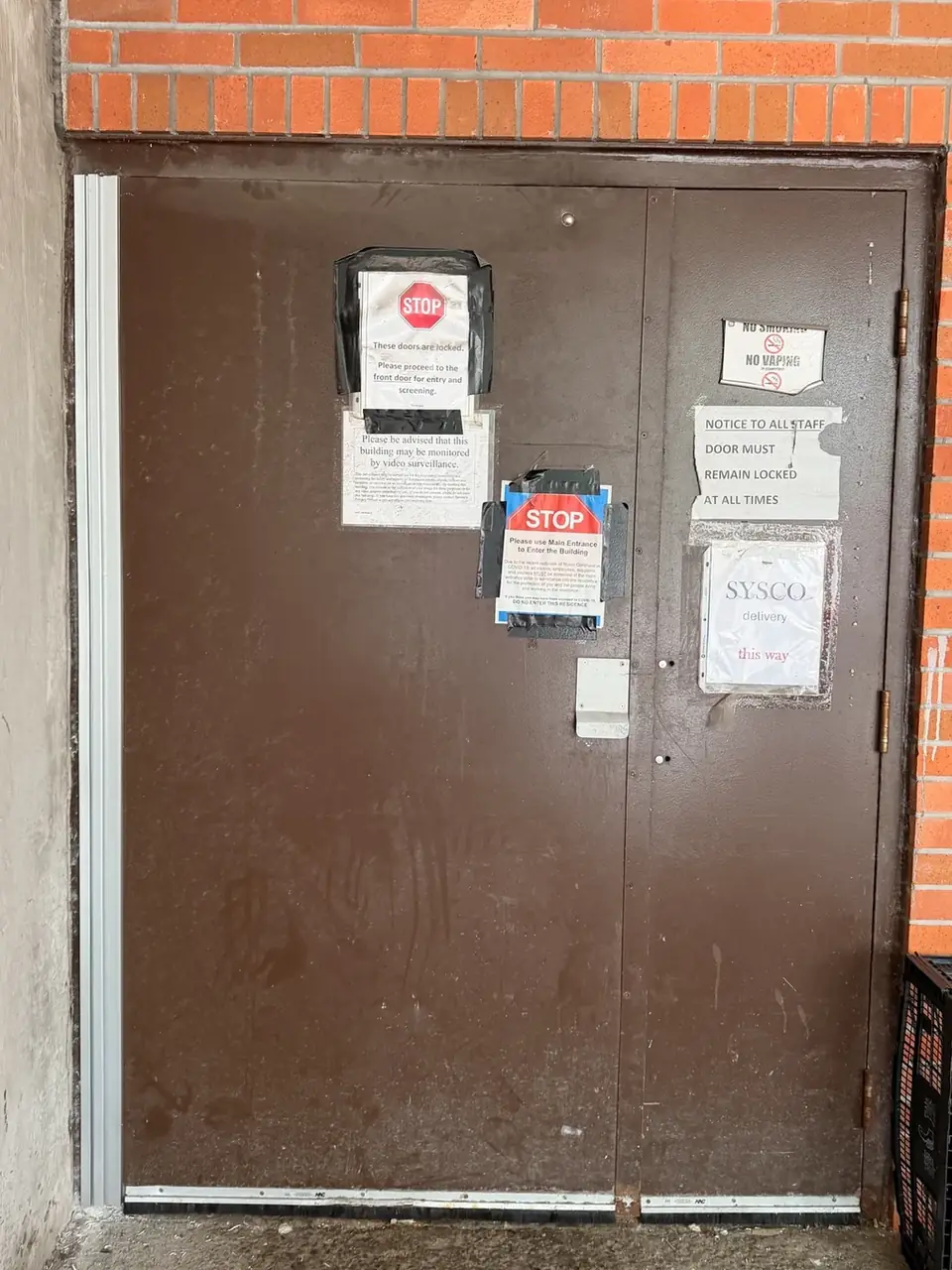 Full-height continuous geared hinge installed on the active steel door leaf in Richmond Hill