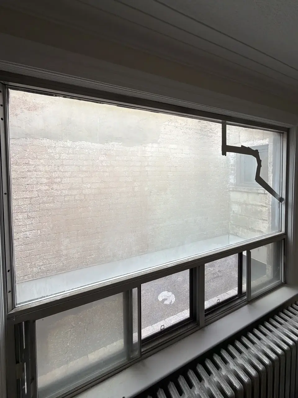 Cracked residential window glass before sealed unit replacement in Fairbank Toronto