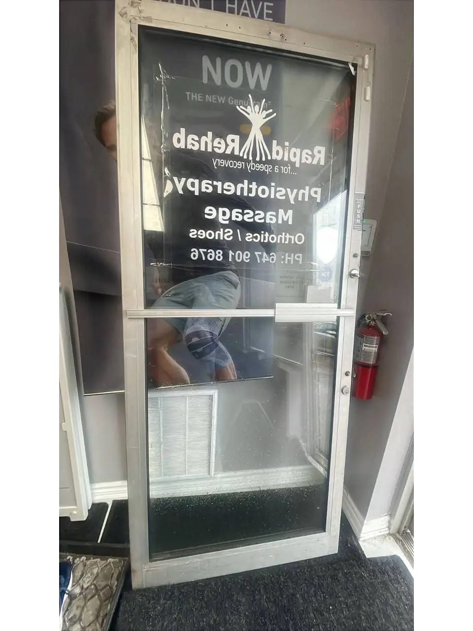 Foggy commercial entrance door glass in Mississauga before replacement