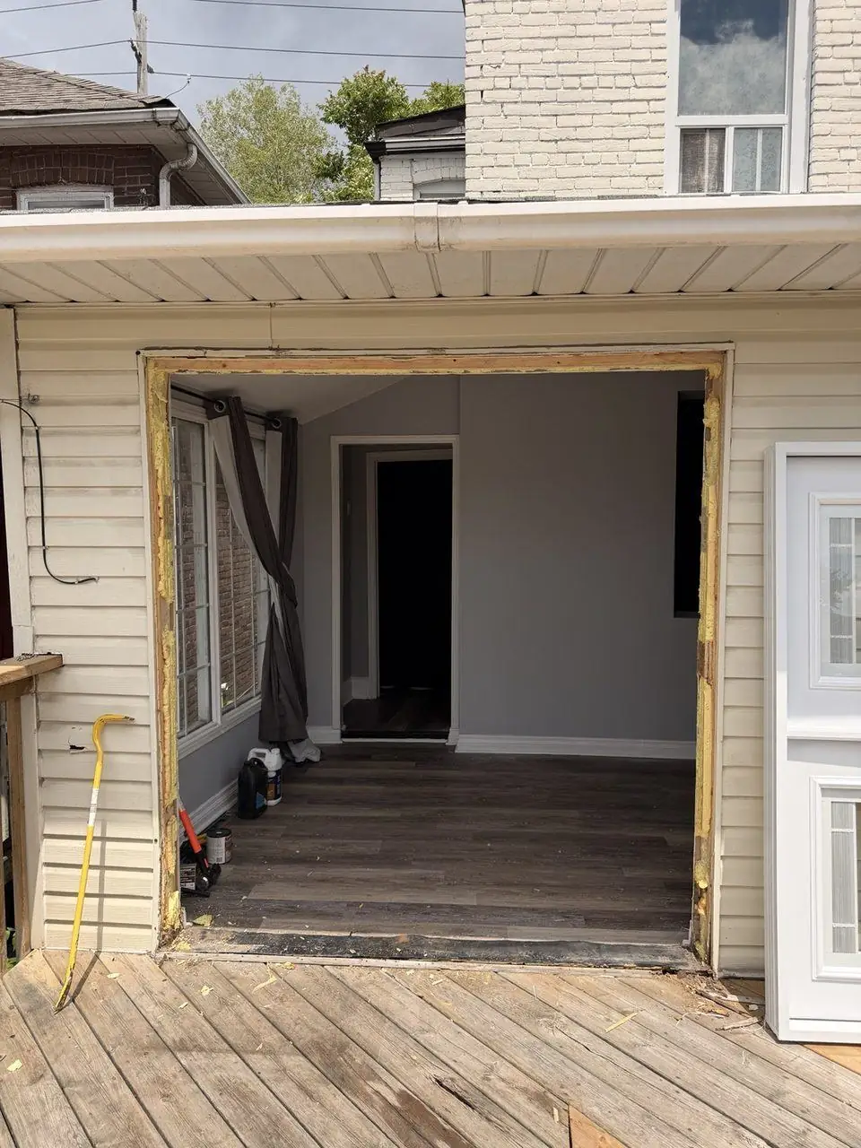 French patio doors removed and rough opening cleared for new door frame installation