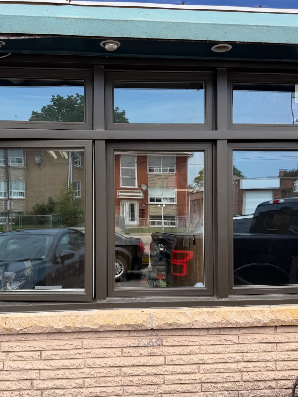 New commercial window glass installed at an auto repair shop on Portland Street in Mimico