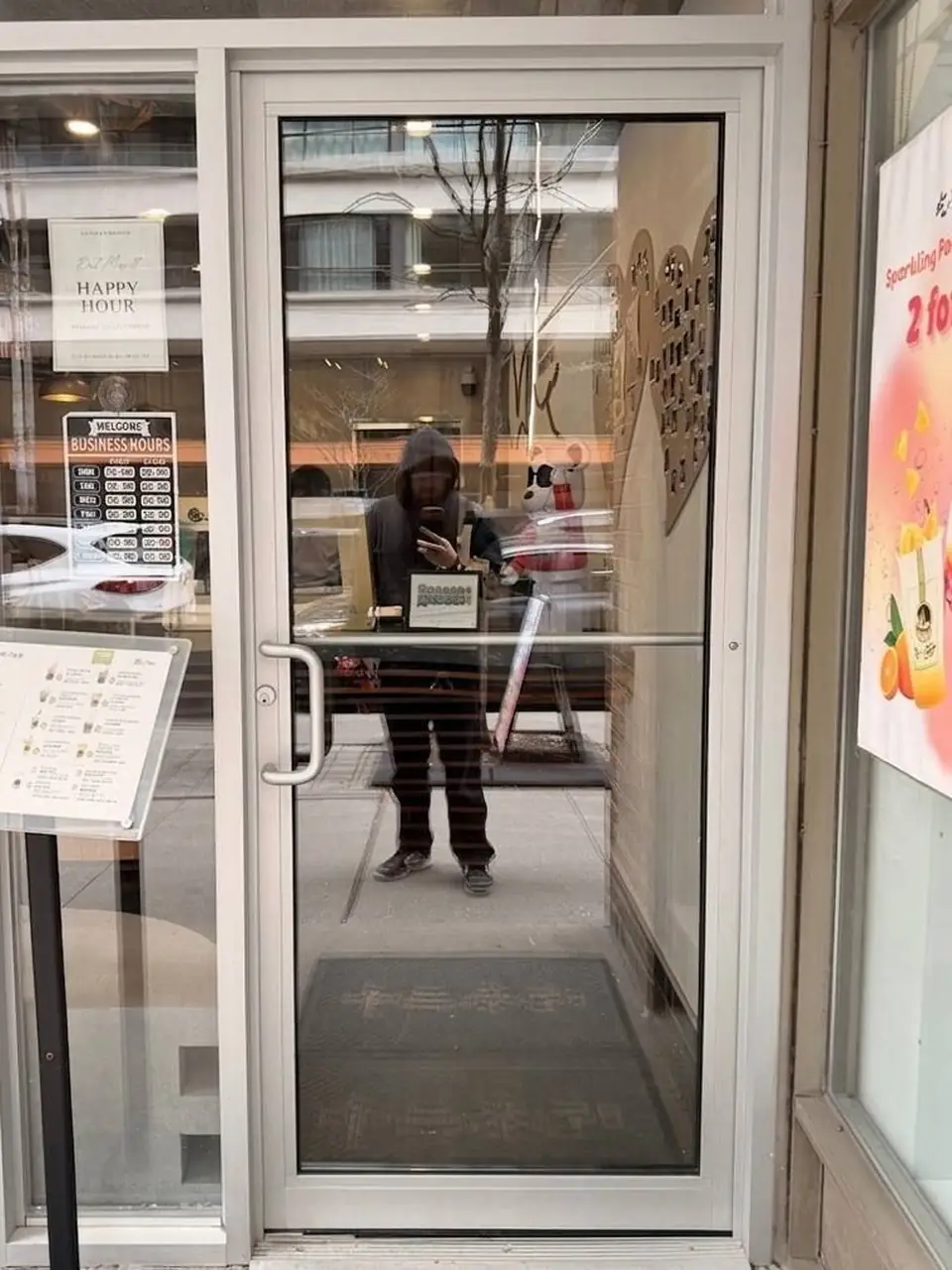 Oshawa tea shop storefront door with new clear glass installed after breakage