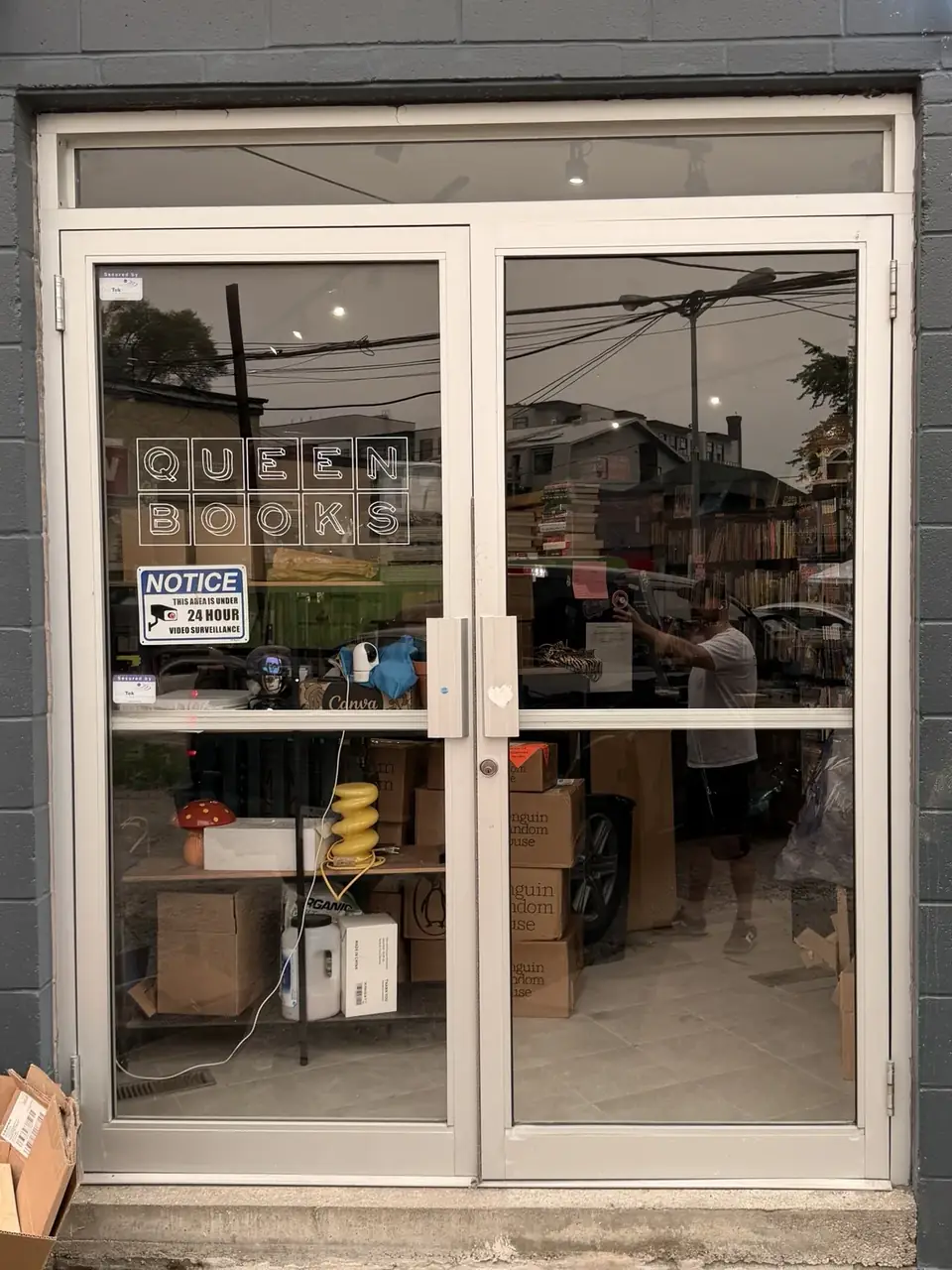 Leslieville storefront door restored with replacement glass the same day