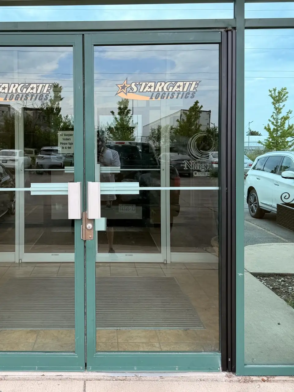 First Mississauga entrance after installation of a full-height continuous geared hinge