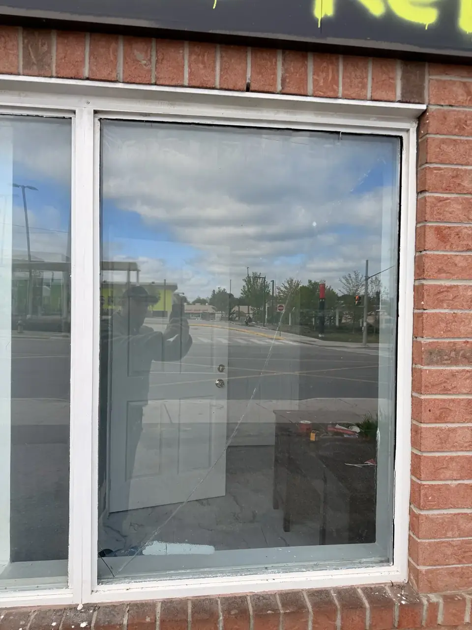 Cracked window pane in York, Toronto before glass replacement